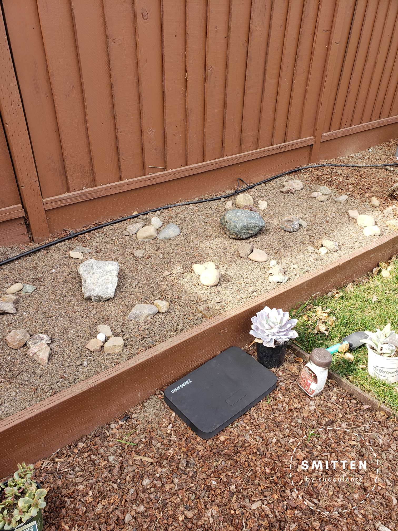 Garden bed with amendment and decorative rocks